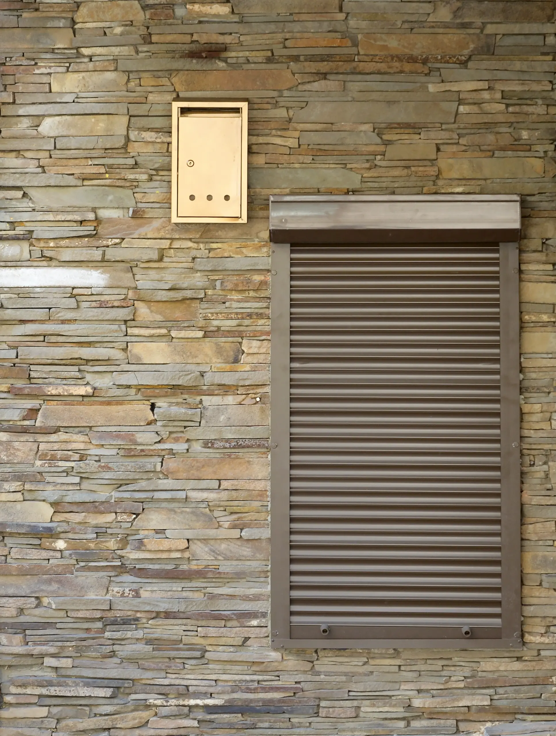a window with brown metal rolling shutters wall d 2025 03 14 16 04 19 utc scaled